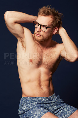 Buy stock photo Cropped view of a muscular man clad in shorts and hipster glasses
