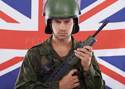 Buy stock photo Military, Britain and gun with portrait of man in studio for war, conflict and patriotic. Army, surveillance and security with person and rifle on uk flag for soldier, battlefield or veteran training