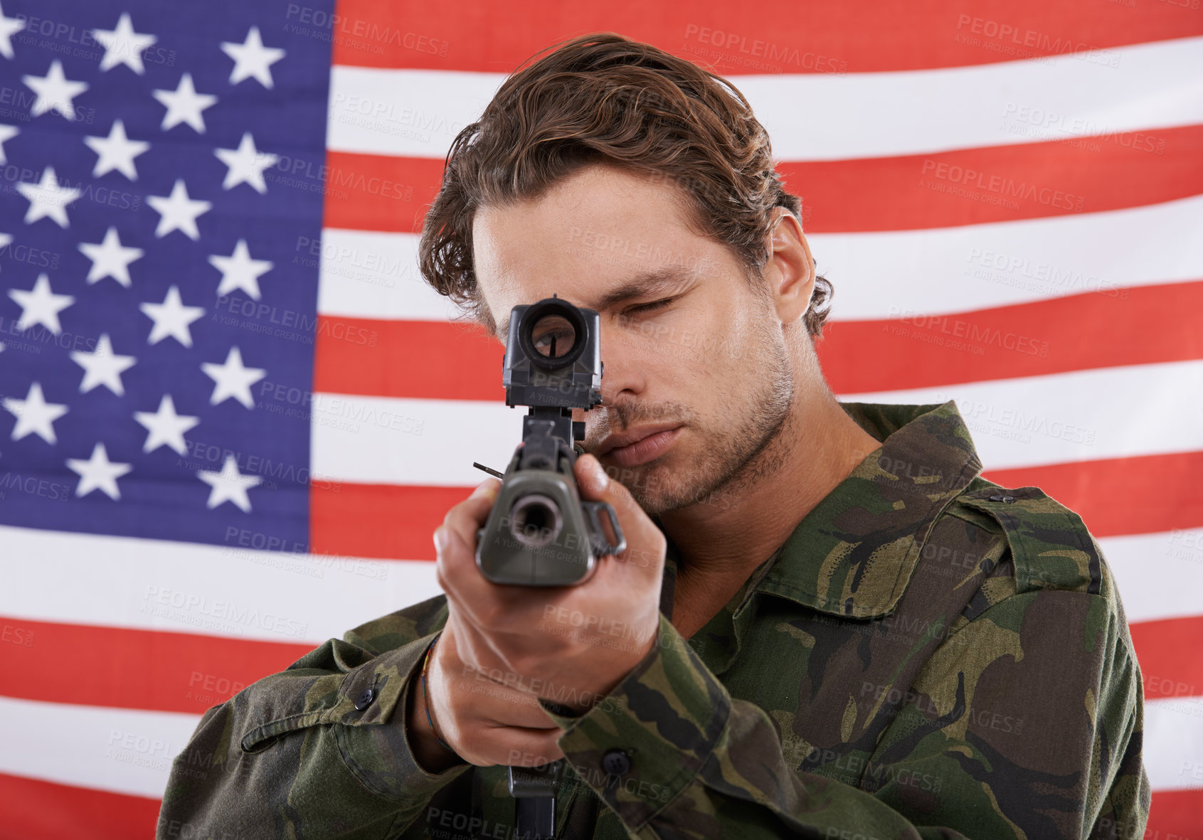 Buy stock photo Military, aim and gun with portrait of man shooting in studio for war, conflict and patriotic. Army, surveillance and security with person on usa flag for soldier, battlefield and American veteran