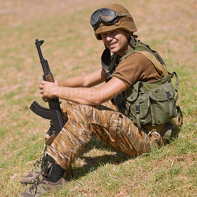 Buy stock photo Military, smile and training with man and gun in nature for war, conflict and patriotism. Army, surveillance and security rifle with person and relax on grass for soldier, battlefield and veteran