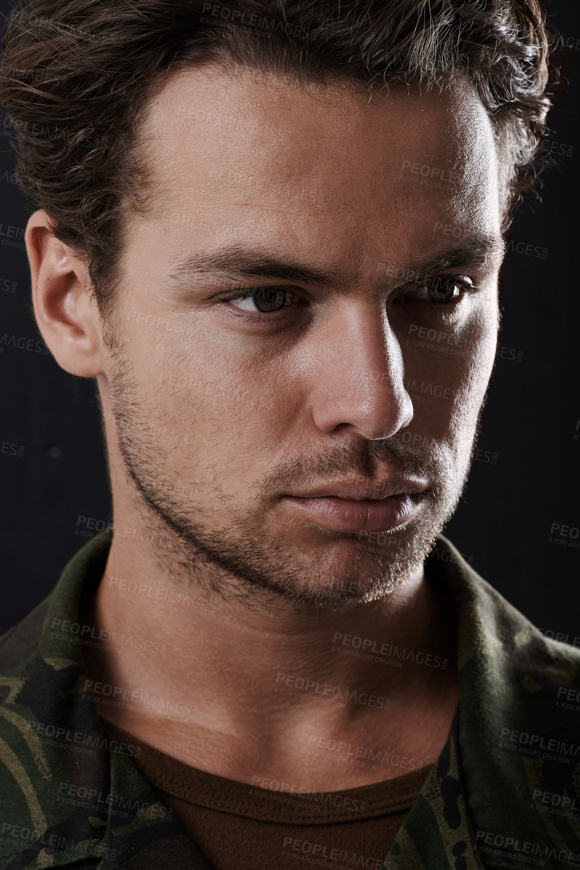 Buy stock photo Man is serious in army uniform, soldier or hero in headshot with military service on black background. Face of warrior, security and protection with mission or operation, courage and tough in studio