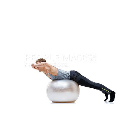 Buy stock photo Fitness, training and man with exercise ball in studio for abs, core or balance challenge on white background. Workout, body or male athlete with inflatable for wellness, sports or stretching routine
