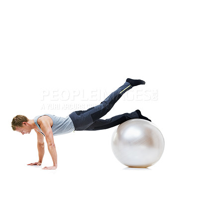Buy stock photo Yoga ball, fitness and man in a studio with a body, health and wellness exercise for balance. Sports, equipment and young male athlete with stretching workout or training isolated by white background