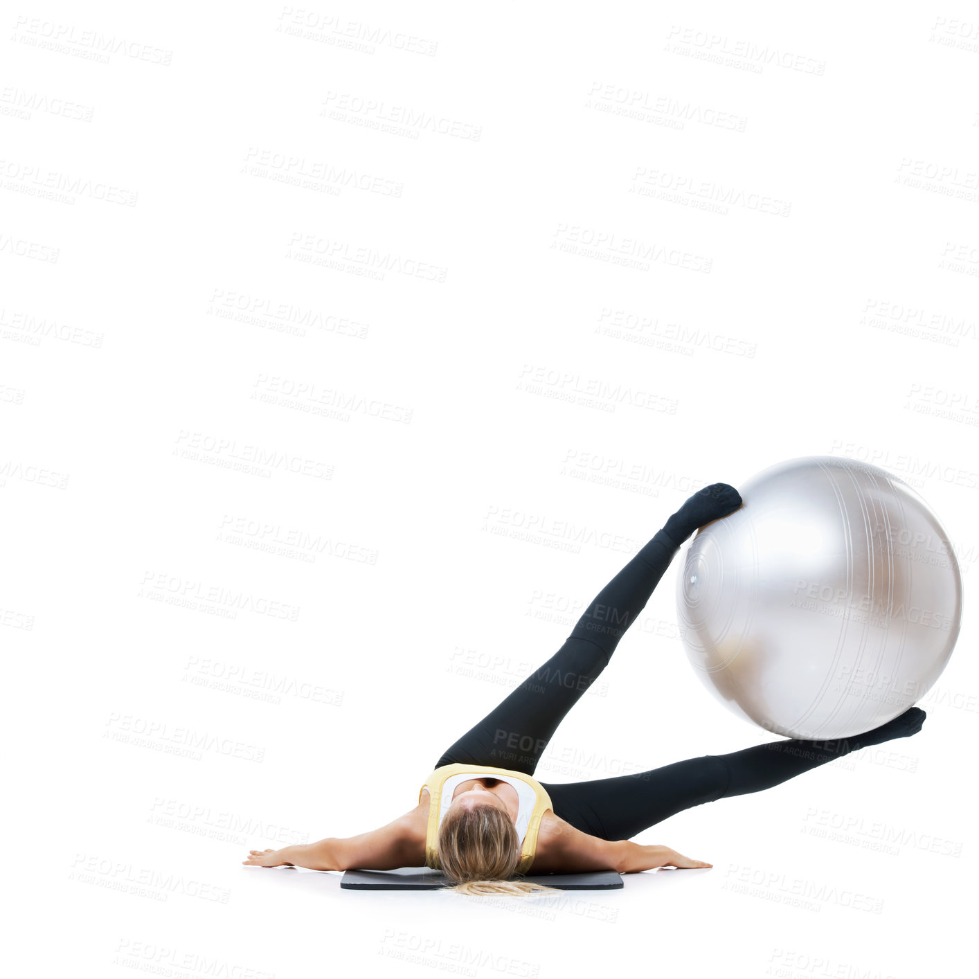 Buy stock photo Exercise ball, mockup and fitness woman on a studio floor for legs, strength or training challenge on white background. Gym, space and lady athlete with inflatable for ground, workout or flexibility 