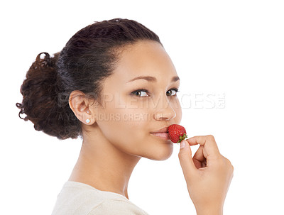 Buy stock photo Portrait, face of woman and eating strawberry in studio for health, vegan diet and nutrition on white background. Model, red berries and sustainable benefits of detox food, vitamin c and sweet fruits