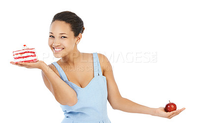 Buy stock photo Woman portrait, apple and cake for healthy food choice, balance and diet decision in studio. Happy, young person or model with red fruit versus cream dessert for detox or vegan on a white background