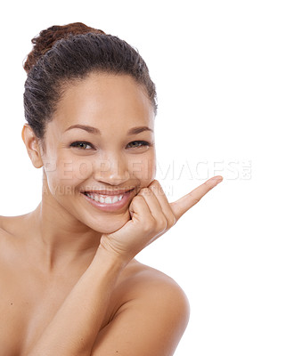 Buy stock photo Woman, portrait and pointing at mockup for beauty, space and brand ambassador for skincare. Person, promotion and face in studio or marketing, direction and advertising offer on white background