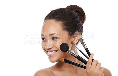 Buy stock photo Makeup, brushes and happy woman in studio thinking of beauty, foundation and cosmetics. Face of young model, artist and person with skincare, application tools and product on a white background