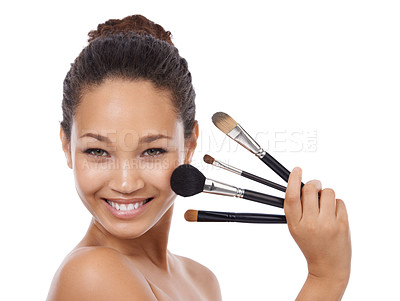 Buy stock photo Makeup, brushes and portrait of happy woman in studio for beauty, foundation and cosmetics. Face of young model, artist and person with skincare, application tools and product on a white background