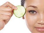 Revitalizing her eyes with cucumber