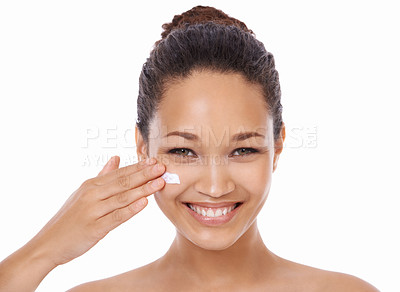 Buy stock photo Happy woman, portrait and cream for facial skincare, beauty or treatment against a white studio background. Natural face of female person or model smile with sunscreen, skin product or spa cosmetics