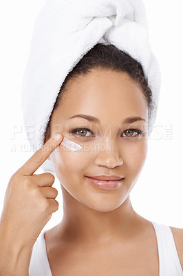 Buy stock photo Young woman, face and beauty cream, skincare and cosmetics on a white background. Portrait of an African model or person with moisturizer application, skin care product and dermatology in studio