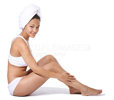 Buy stock photo Happy woman, legs and skincare in studio portrait for hair removal results and beauty on floor on a white background. Young person or model in underwear with body cosmetics, dermatology and hygiene