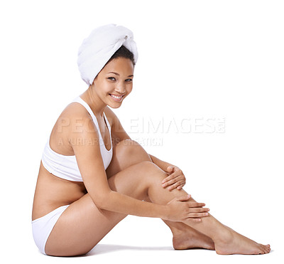 Buy stock photo Woman, legs and skin care in studio portrait for hair removal results and beauty on floor on a white background. Young person or happy model in underwear with body cosmetics, skincare and dermatology
