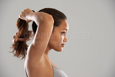Buy stock photo Fitness, tie hair or profile of model isolated on grey background for wellness or sports. Woman, ponytail or person with natural hairstyle ready to start exercise, training or workout in studio 