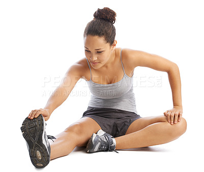 Buy stock photo Woman, fitness and stretching legs in studio for workout, training and wellness a white background. Young person, athlete or runner in sneakers with muscle health, foot exercise and warm up on floor