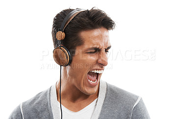 Buy stock photo Man, headphones and singing in studio with music for relax, break and screaming  with mock up space. Person, radio or audio and shouting for enjoyment, track and podcast on white background for sound