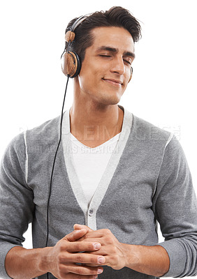 Buy stock photo Music, man and headphones in studio for calm connection, audio subscription and streaming multimedia playlist on white background. Happy model listening to peaceful podcast, hearing sound and radio