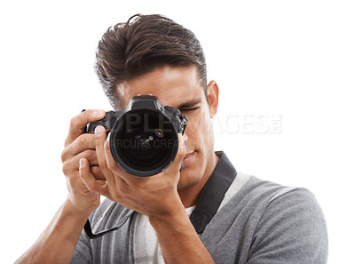 Buy stock photo Photographer, man and camera in studio for digital photoshoot, creative production and content creation on white background. Journalist, cameraman and multimedia artist click lens for photography