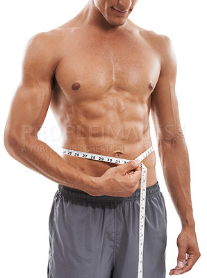 Buy stock photo Muscular man, waist and tape measure for weight loss, diet or exercise against a white studio background. Closeup of male person hands measuring body, size or length for health and wellness on mockup