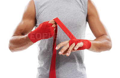 Buy stock photo Hands, wrapping with red cloth and boxing, fitness and person training in martial arts isolated on white background. Closeup of fighter strapping wrist, protection or safety with MMA in a studio