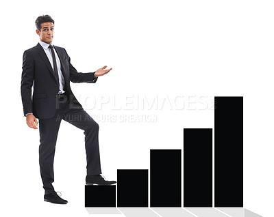 Buy stock photo A handsome young businessman standing next to a black bar-graph and using it as a step against a white background