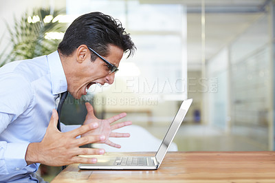 Buy stock photo Profile of an angry businessman shouting at his laptop at work