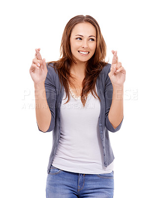 Buy stock photo Fingers crossed, woman and hope in studio for luck, results and optimism on white background. Happy young model, thinking and wish for bonus giveaway, winning lottery prize or praying with emoji sign