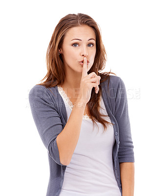 Buy stock photo Casually dressed woman gesturing with her finger on her lips - isolated on white