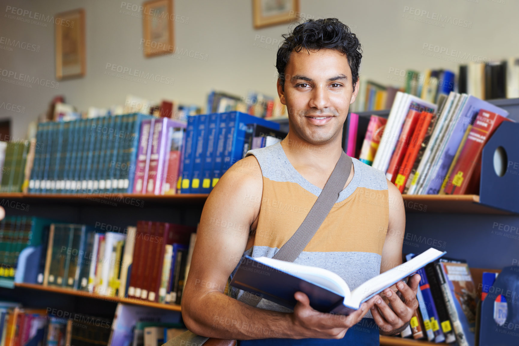 Buy stock photo Reading book, portrait or happy man in library at university, college or school campus for education. Bookshelf, learning or male student with scholarship studying knowledge, research or information