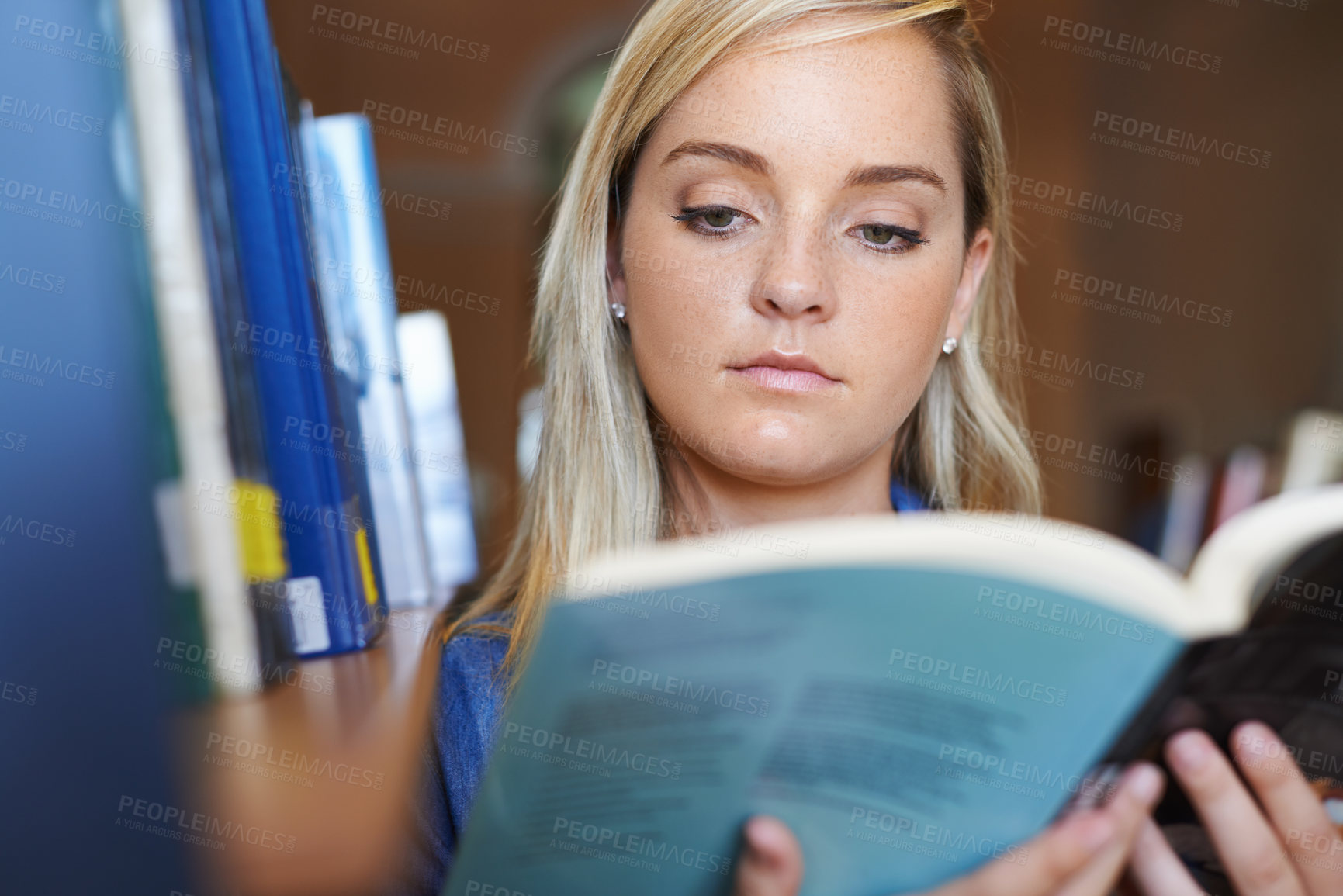 Buy stock photo Reading book, face or woman in library at university, college or school campus for future education. Bookshelf, learning or female student with scholarship studying knowledge, research or information
