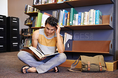 Buy stock photo Reading book, floor or student in library at university, college or school campus for education growth. Bookshelf, learning or smart man with scholarship studying knowledge, research or information