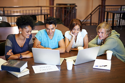 Buy stock photo Teamwork, laptop or students studying together in school, university library or college for education. Diversity, elearning or group of people with scholarship reading news, research or online course