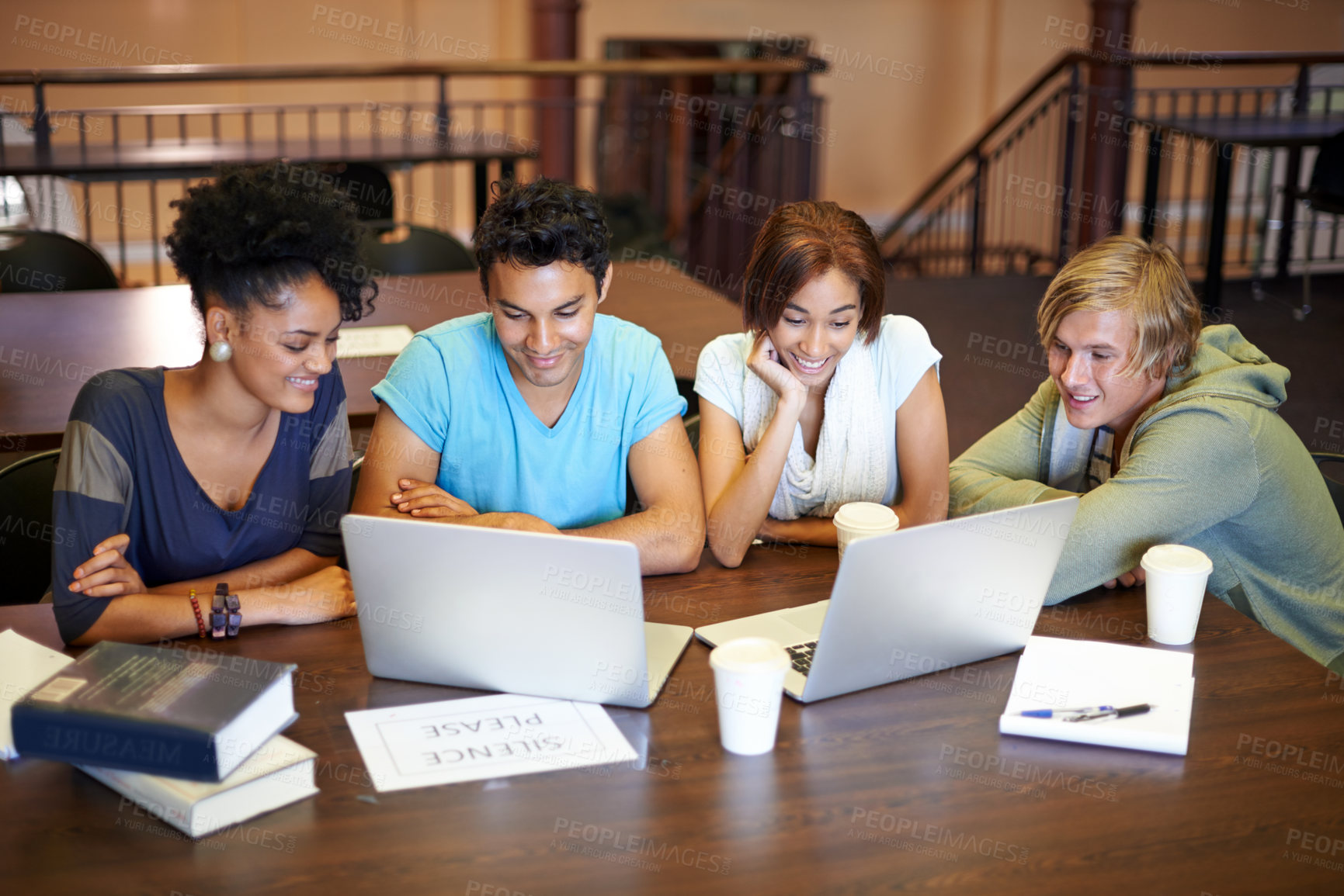 Buy stock photo Teamwork, laptop or students studying together in school, university library or college for education. Diversity, elearning or group of people with scholarship reading news, research or online course