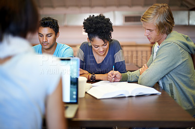 Buy stock photo A group of young people studying together for the upcoming exams