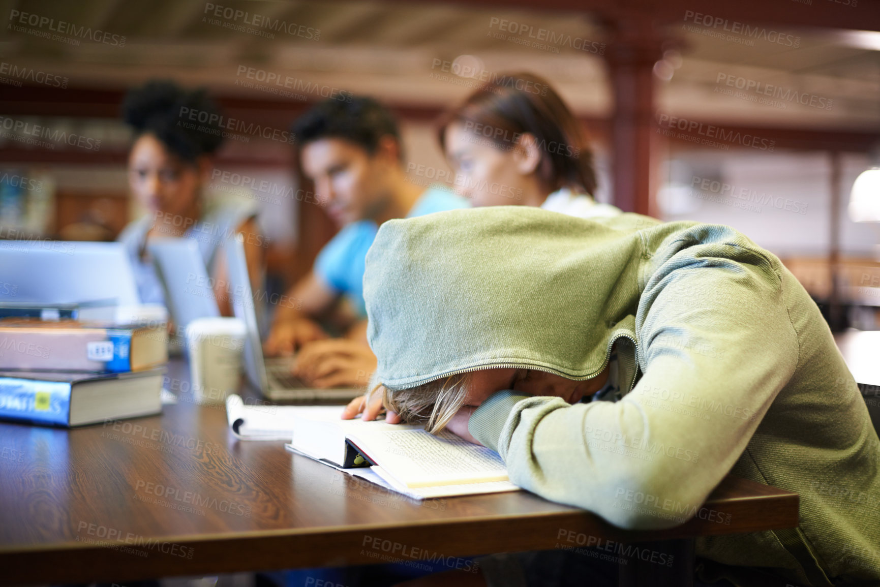 Buy stock photo A young student in a study group suffering from the exhaustion of finals