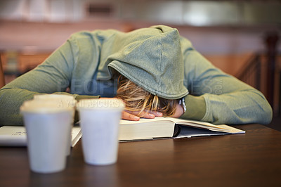 Buy stock photo Tired, student or sleeping in library with burnout, stress depression or low energy for deadline. Fatigue, university or exhausted person with books, coffee or head down in nap on table for resting