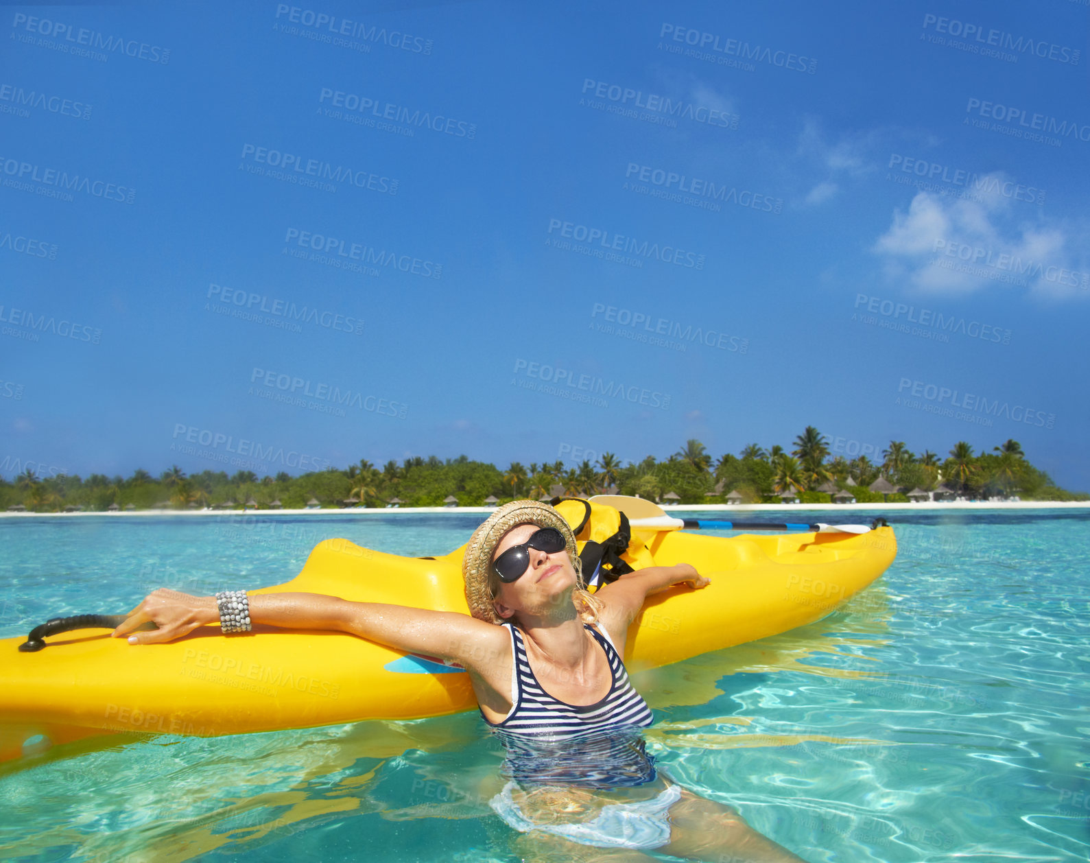 Buy stock photo Woman, kayak and tropical sea in summer with sunglasses, mockup space and blue sky background by island. Person, boat or ship for transport, holiday or travel on vacation in sunshine, water or ocean