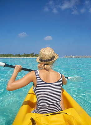 Buy stock photo Woman, kayak and tropical ocean in summer in hat, mockup space or blue sky background by island. Person, boat or back for transport, holiday or travel on vacation in sunshine, water or sea for rowing