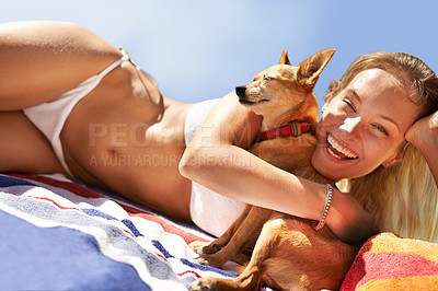 Buy stock photo Portrait of a beautiful young woman and her dog at the beach
