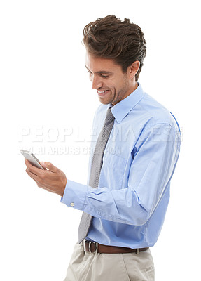 Buy stock photo Phone, smile and social media with business man in studio isolated on white background for communication. Contact, app or meme with happy young employee reading text message on mobile for networking