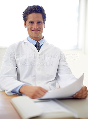 Buy stock photo Smile, document and portrait of man doctor in the office for consultation in a medical hospital. Happy, reading and professional young male healthcare worker with paperwork for research in a clinic.
