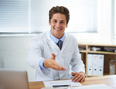 Buy stock photo Handshake, happy and man doctor in office for greeting hello at a medical consultation at clinic. Smile, professional and young male healthcare worker with shaking hand gesture in a medicare hospital