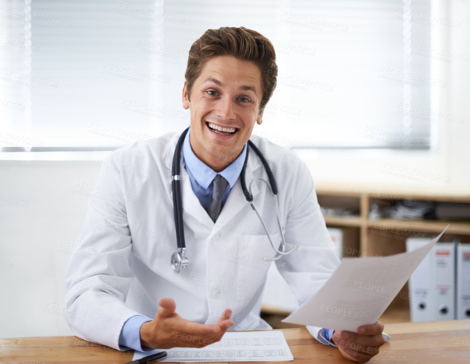 Buy stock photo Smile, document and portrait of man doctor in the office for consultation in a medical hospital. Happy, reading and professional young male healthcare worker with paperwork for research in a clinic.