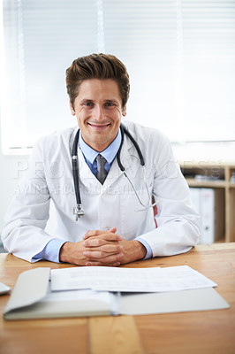Buy stock photo Happy, confident and portrait of doctor in office for consultation with positive and good attitude. Smile, career and professional young male healthcare worker with pride at desk in medical clinic.