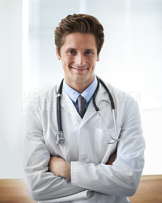 Buy stock photo Smile, crossed arms and portrait of man doctor with stethoscope for positive, good and confident attitude. Happy, pride and young male healthcare worker in medical office of hospital or clinic.
