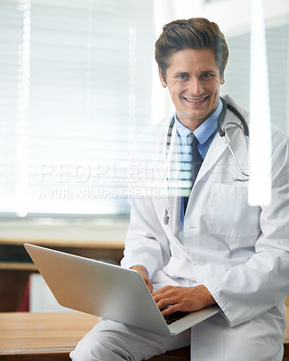 Buy stock photo Happy man, portrait and doctor with laptop for research, networking or communication at hospital. Male person, surgeon or medical professional smile on computer for online search on desk at clinic