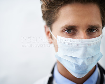 Buy stock photo Man, portrait and doctor with face mask for safety, protection or health on mockup space. Closeup of male person, surgeon or medical professional for safe healthcare on a white studio background
