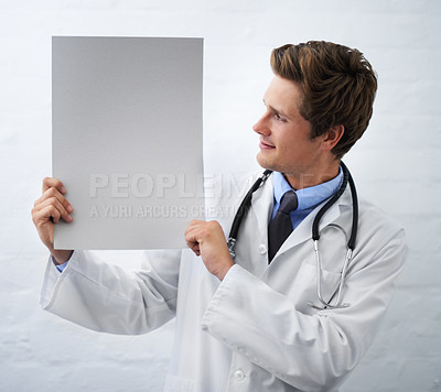 Buy stock photo Man, doctor and billboard in healthcare for advertising or marketing on a white studio background. Male person, nurse or medical surgeon holding empty poster or blank sign for message on mockup space