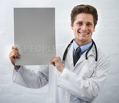 Buy stock photo Happy man, portrait and doctor with poster in healthcare, advertising or marketing on a white studio background. Male person, nurse or medical surgeon smile with banner, blank sign or mockup space